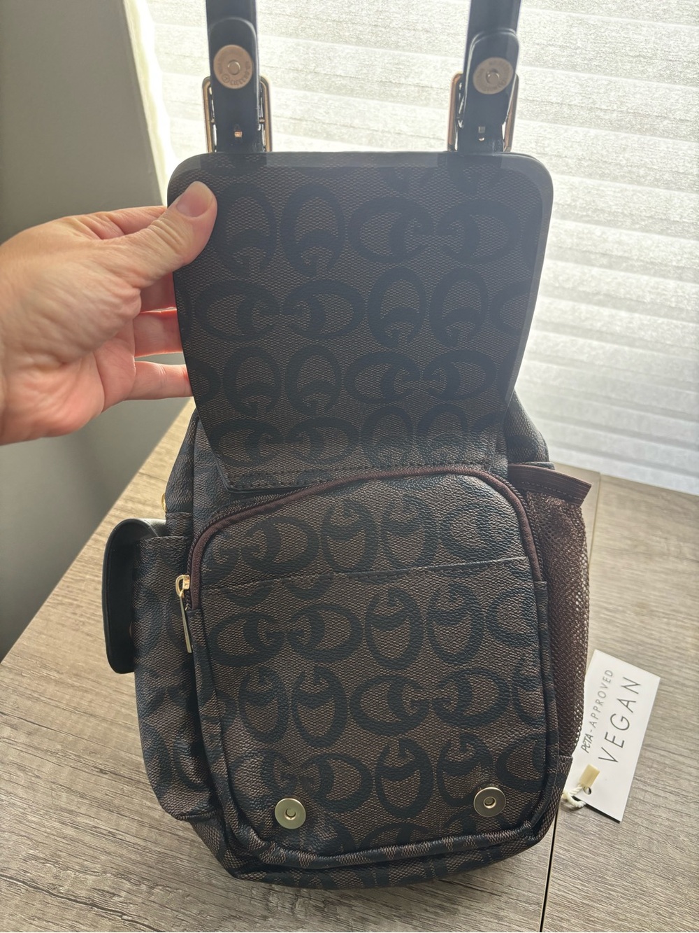 Brown Sling Backpack with Signature Pattern - Picture 4 of 8